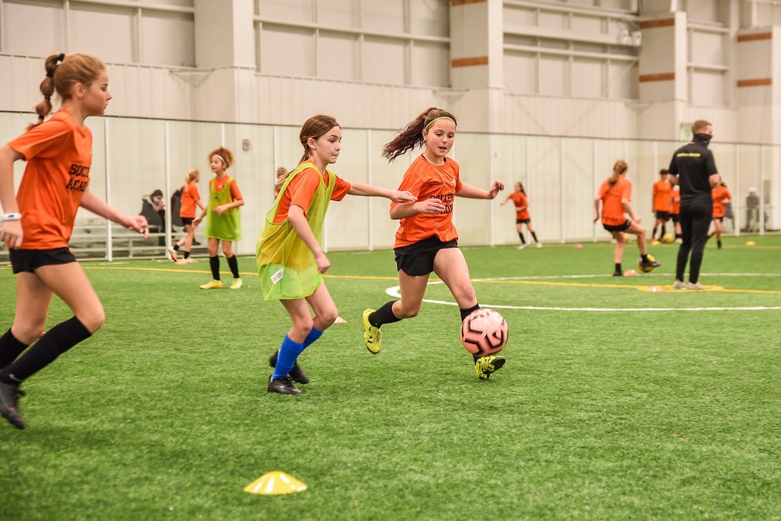girls playing indoor soccer
